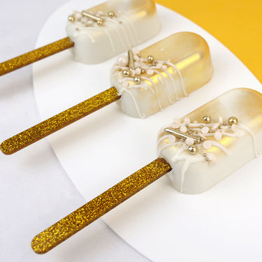 Palito para popsicle glitter dourado - 12 un